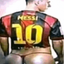 a man wearing a red and black jersey with the number 10 on the back