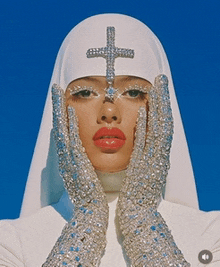 a nun with a cross on her head
