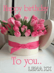 a bouquet of pink flowers in a white box with the words happy birthday lena xx