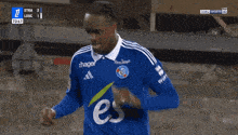 a soccer player with the number 10 on his shorts is celebrating a goal