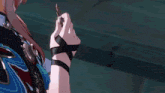 a close up of a person holding something in their hand with the letter b on it