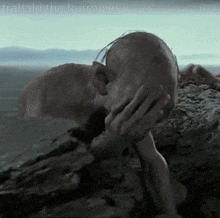 a picture of a man covering his face with his hand and the words trahald the burrower above him