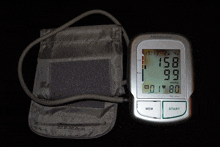 a medisana blood pressure monitor displays a reading of 159 over 99