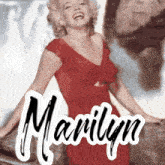 a picture of marilyn monroe in a red dress with the name marilyn on the bottom