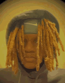a man with dreadlocks has a nike headband on his head