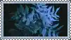 a postage stamp with a picture of a palm tree in the dark