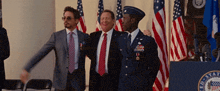 three men are posing for a picture in front of a podium that says ' united states of america '