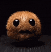 a close up of a kiwi with a face and eyes closed