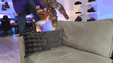 a statue of a man is standing on a couch in a room