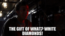the gift of what ? white diamonds ! is written in white on a red background