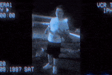 a man is standing in front of a sign that says era1 my