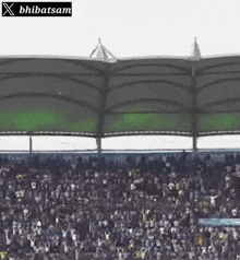 a stadium full of people with a sign that says ' x bhibatsam '