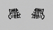 chinese characters on a gray background with a few dots