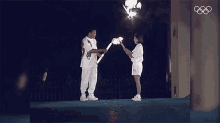 Pass The Flame Muhammad Ali GIF