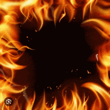 a circle of fire on a black background with a circle in the middle