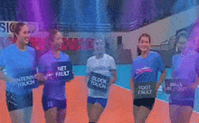 a group of volleyball players holding up signs that say net fault block touch foot fault and antenna touch