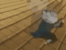 a cartoon character is running down a set of stairs with a helmet on his head .