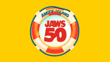 a picture of a shark with a life preserver in the background that says aqualand
