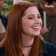 a close up of a woman 's face with a hulu logo behind her