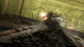 a person is holding a gun in a room with a lot of wires