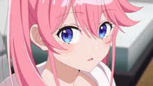 a girl with pink hair and blue eyes is looking at the camera