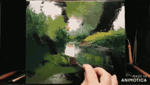 a painting is being painted on a canvas and the words made in animotica are visible