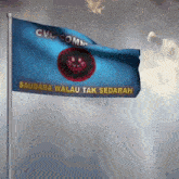 a blue flag that says cvc comm saudara walau tak sedarah