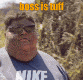 a man wearing sunglasses says boss is tuff