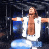 a shirtless wrestler is standing in front of a sign that says yles