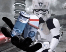 a storm trooper is holding two cans of soda in his hands