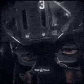 a close up of a person 's face with the number 2 on the top