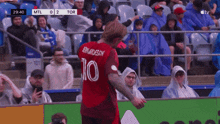 a soccer player with the number 10 on the back of his shirt