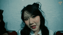 a close up of a girl with jk48 written on the bottom