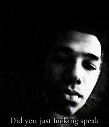 a black and white photo of a man 's face with the words " did you just fucking speak " below it