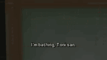 a man standing in a room with the words i 'm bathing toni san on the floor