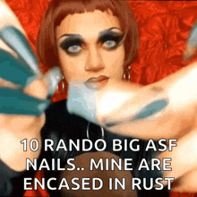 a picture of a drag queen with a caption that says 10 rando big asf nails mine are encased in rust