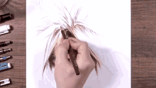 a person is drawing a picture with a pencil that says ' sketch ' on it