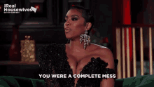 a woman sitting on a green couch with the words " you were a complete mess "