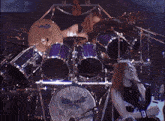 a drummer playing a drum set with a drum that says ' pro mica ' on it