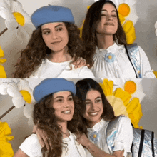 two women are posing for a picture and one has a blue hat