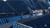 a man in a blue shirt is running down a ramp .