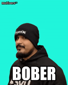 a man with a beard wearing a beanie and a hoodie with the word bober on it