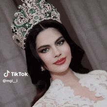 a woman wearing a crown and a white dress has a tiktok watermark