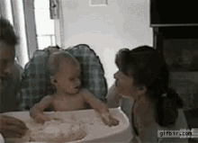 Food Fight Baby GIF - Food Fight Baby Parents GIFs