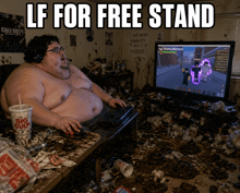 a fat man playing a video game in a messy room with a big gulp drink