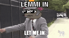 a man in a suit and tie with a cartoon mouse on his head and the words lemmi in let me in
