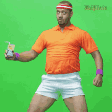 a man in an orange shirt and white shorts is holding a bottle of big mac