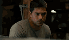 a close up of a man 's face in a room