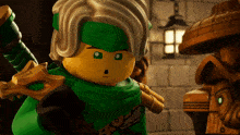 a lego character with a green scarf around his neck