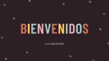 a colorful sign that says bienvenidos on a black background